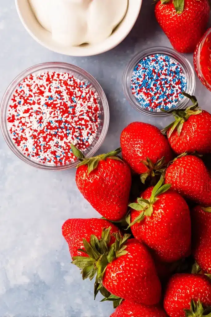 4th of July Strawberries 2 Fresh ingredients for 4th of July Strawberries with white chocolate and patriotic sprinkles