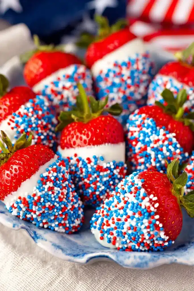 4th of July Strawberries 1 4th of July strawberries dipped in white chocolate with red white and blue sprinkles
