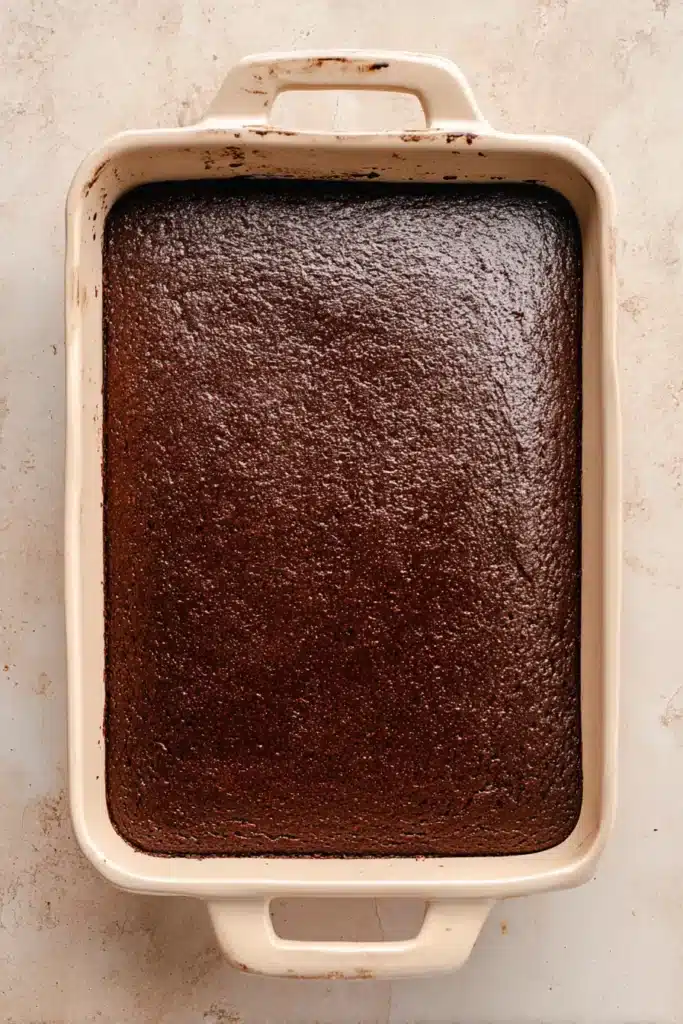 Oreo Dirt Cake Recipe 2 Freshly baked chocolate cake in a ceramic baking dish for Oreo dirt cake recipe