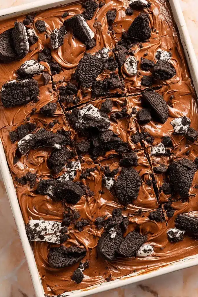 Oreo Dirt Cake Recipe 1 Oreo dirt cake with creamy chocolate topping and crushed Oreo cookies in a baking dish