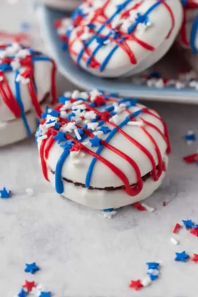 Oreos Dipped in White Chocolate 2 Oreos Dipped in White Chocolate with red and blue drizzle