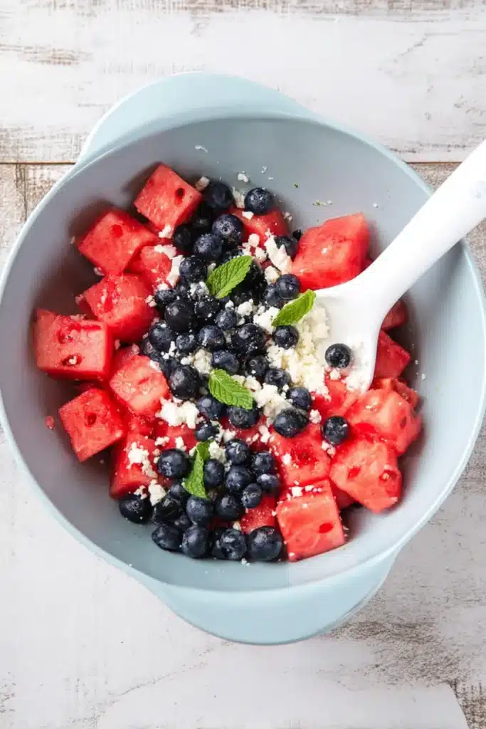 Watermelon Feta Blueberry Salad 3 Watermelon Feta Blueberry Salad ingredients mixed in a bowl before tossing