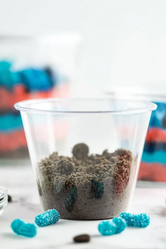 Red White and Blue Dirt Cups 3 Red White and Blue Dirt Cups with Oreo crumb base in clear dessert cup