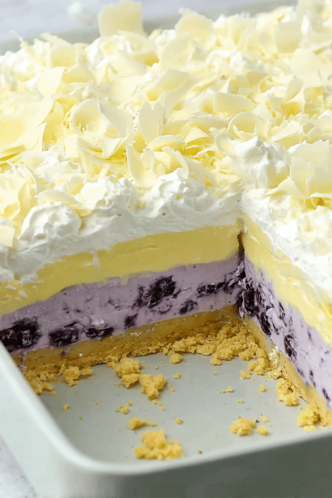 Lemon Blueberry Lasagna 5 Lemon Blueberry Lasagna sliced to show creamy layered dessert filling