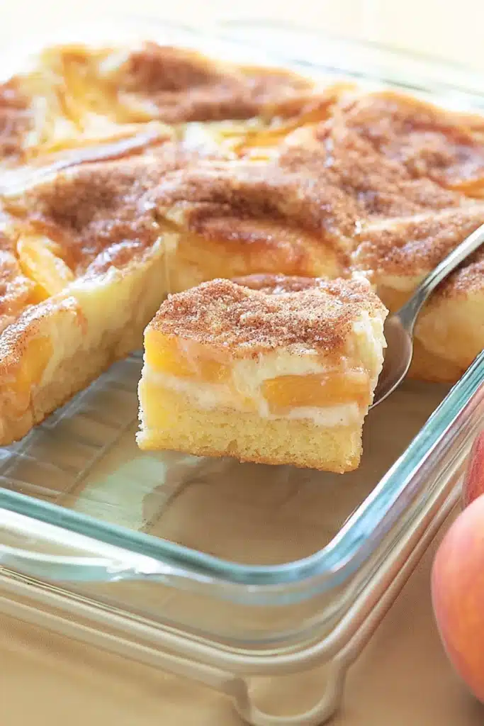 Peaches and Cream Pie slice showing creamy layers and juicy peaches