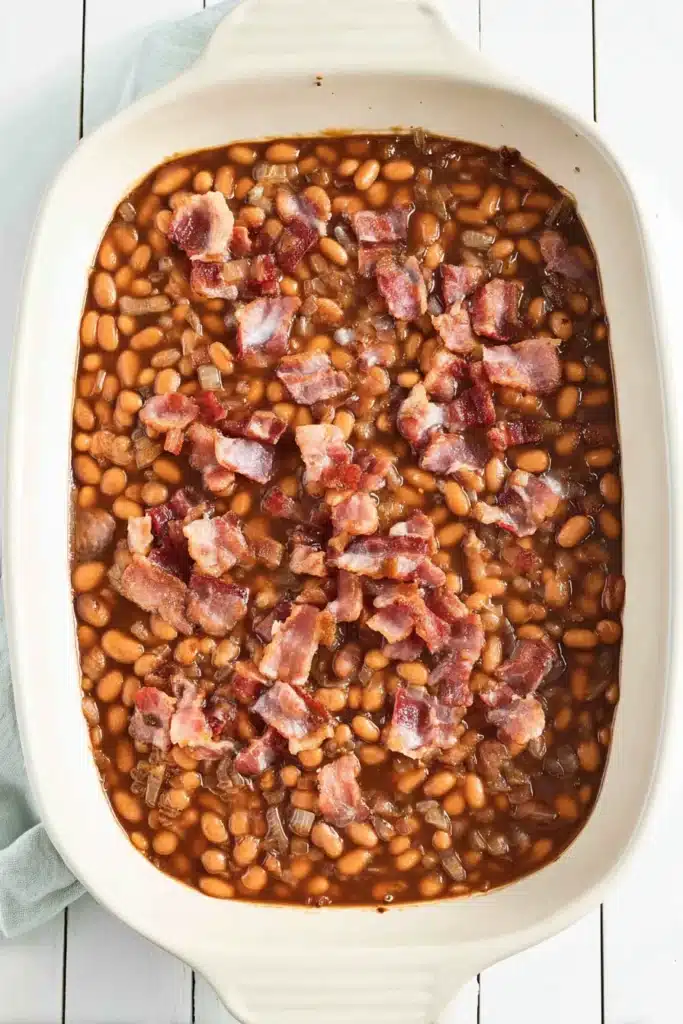 BBQ Baked Beans in baking dish topped with crispy bacon