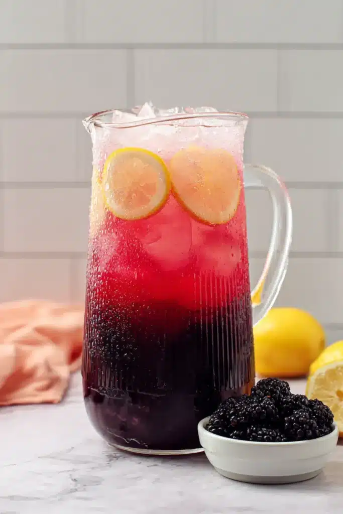 Blackberry Lemonade 2 Blackberry Lemonade pitcher with lemon slices and ice ready for serving