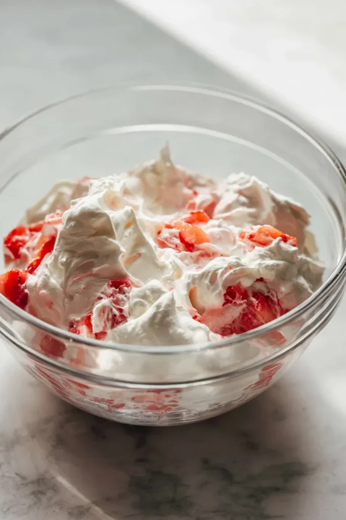 Homemade Strawberry Shortcake 2 Homemade Strawberry Shortcake whipped cream and strawberry filling in a bowl