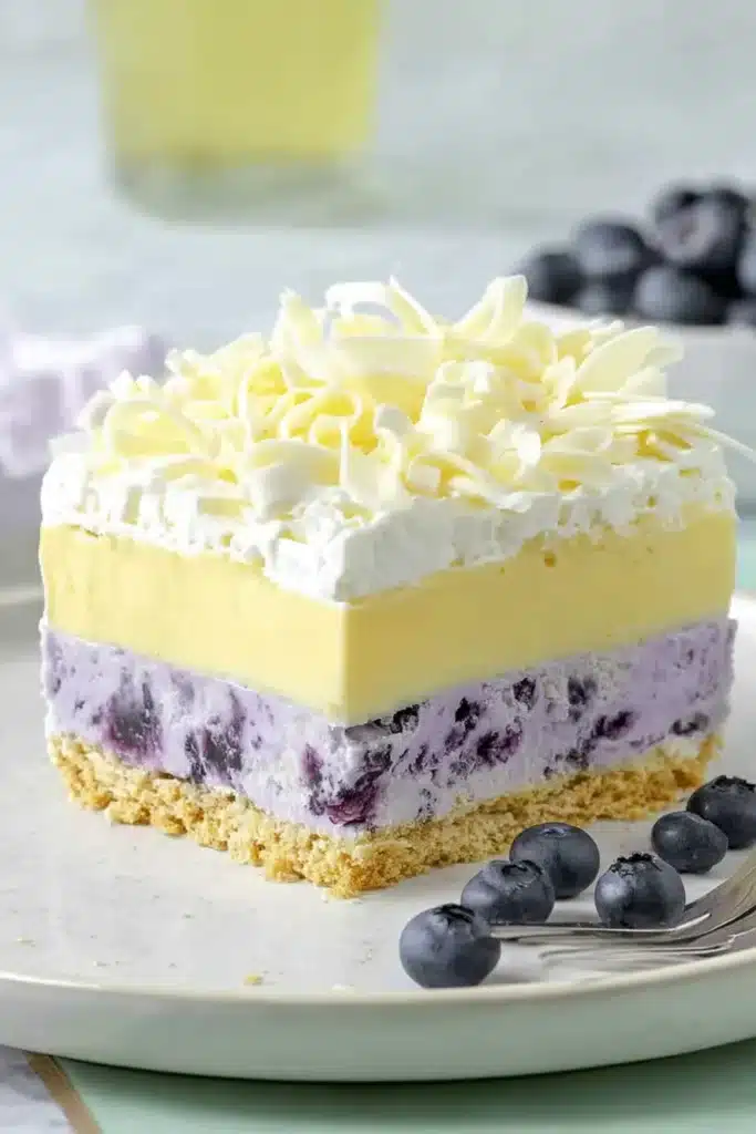 Lemon Blueberry Lasagna 1 Lemon Blueberry Lasagna Golden Oreo crust pressed into baking dish