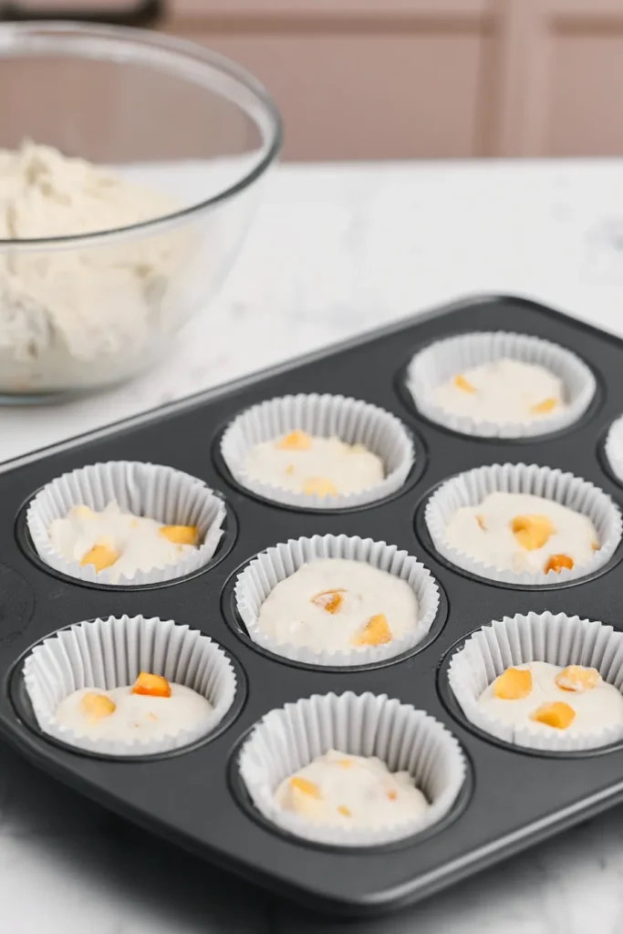 Peach Bellini Cupcakes 4 Peach Bellini Cupcakes batter portioned into cupcake liners