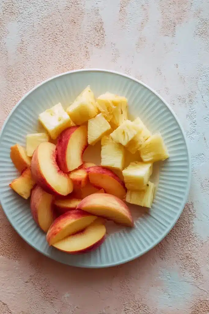 Fresh peaches and pineapple for Pineapple Peach Agua Fresca recipe