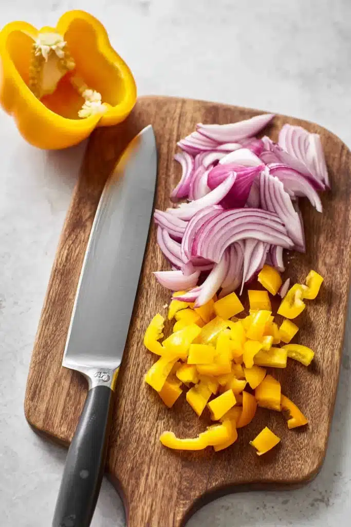 Southwest Salad Recipe 2 Southwest Salad ingredients with sliced red onion and diced yellow bell pepper