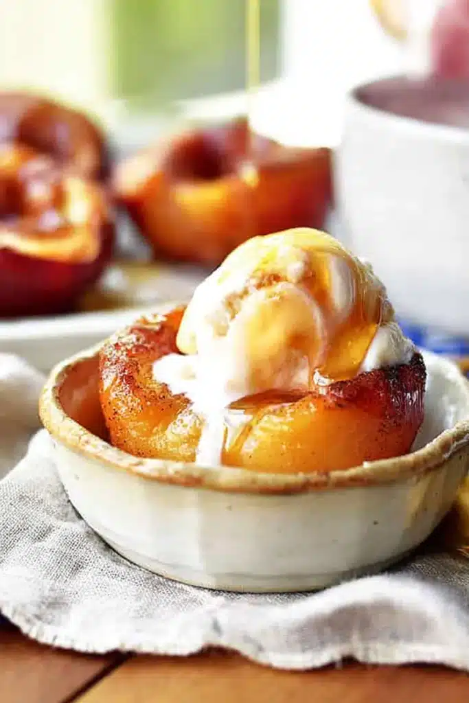 Cinnamon Sugar Baked Peaches 1 Cinnamon sugar baked peaches with vanilla ice cream and caramel drizzle